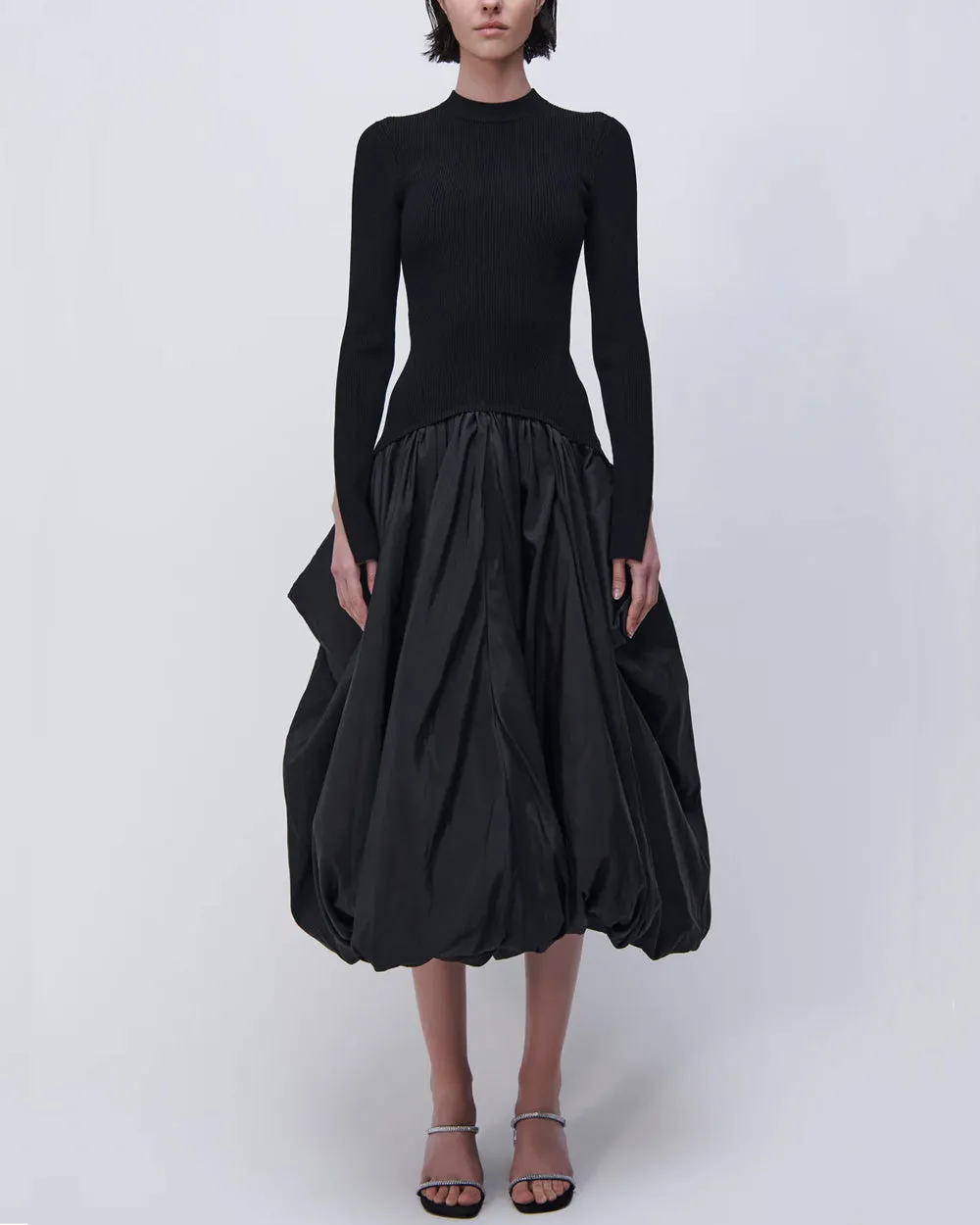 Black long sleeve dress with mock neck, midi length.