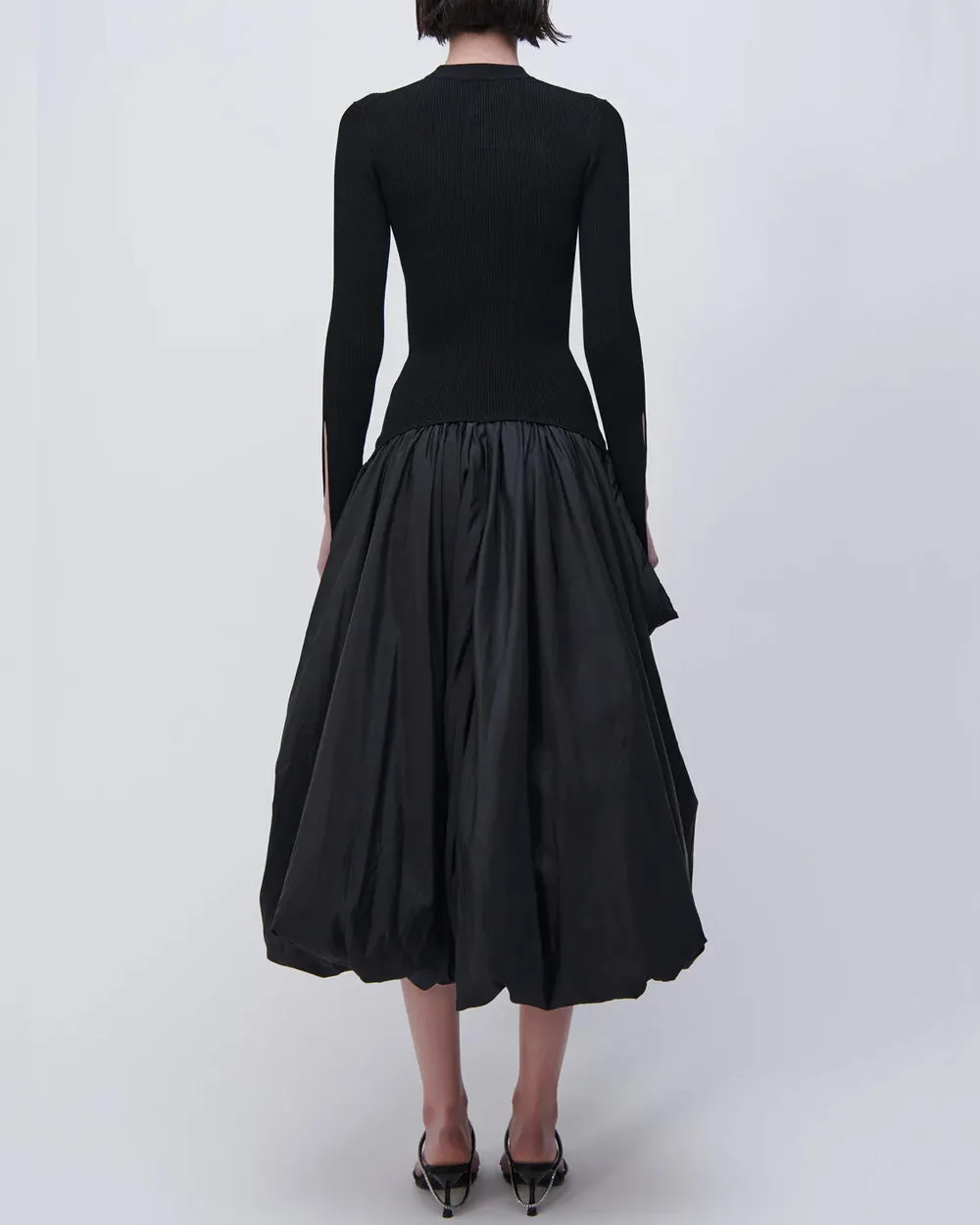 Black long sleeve dress with mock neck, midi length.