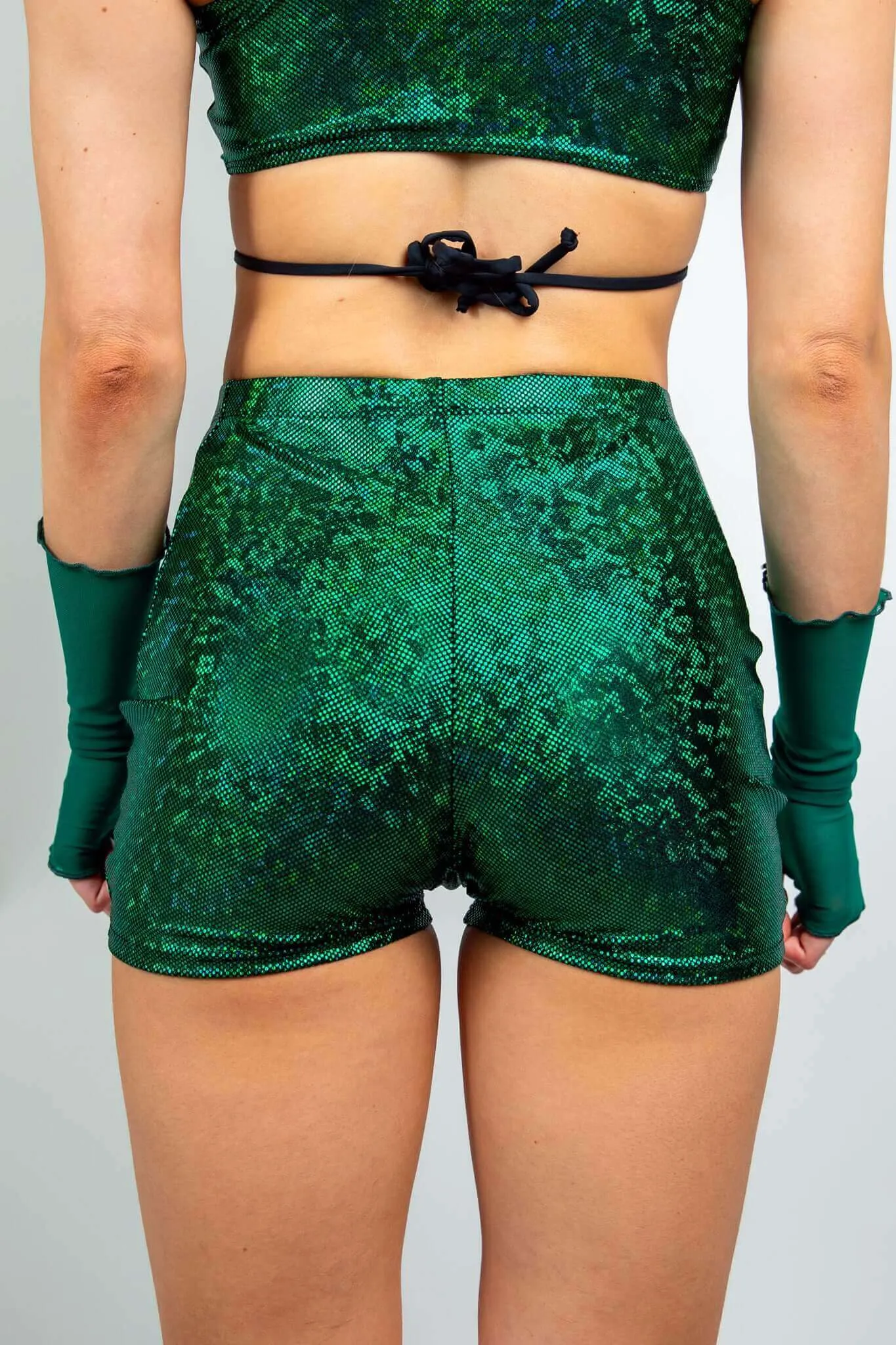 Emerald holographic high-waist shorts.