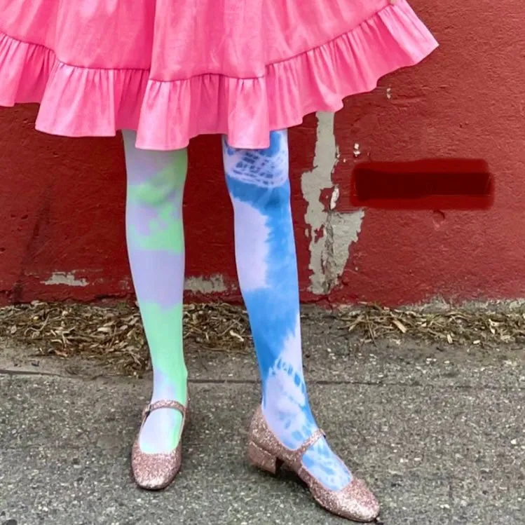 Upcycled lime and blue tights with a dramatic flair